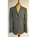 A Pytchley grey wool fitted hacking-style jacket with black/orange check (size 10) 'Manufactured by