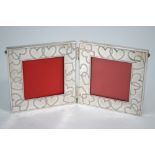 A Tiffany & Co silver folding ornate photograph frame, engraved with hearts, 10.3 x 20.