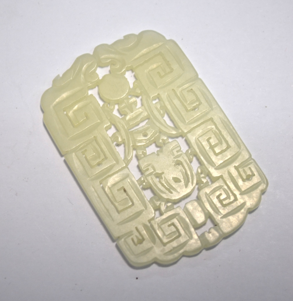 A Chinese green jade pendant of whitish hue, - Image 4 of 7