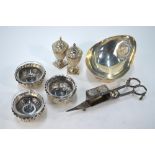 Three Victorian embossed and chased silver open salts on ball feet, with glass liners,