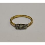 A three-stone old cut diamond ring, yellow and white metal set,