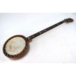 An antique rosewood banjo,