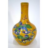 A famille rose vase decorated on the imperial-yellow ground with a pair of Buddhist lions beside