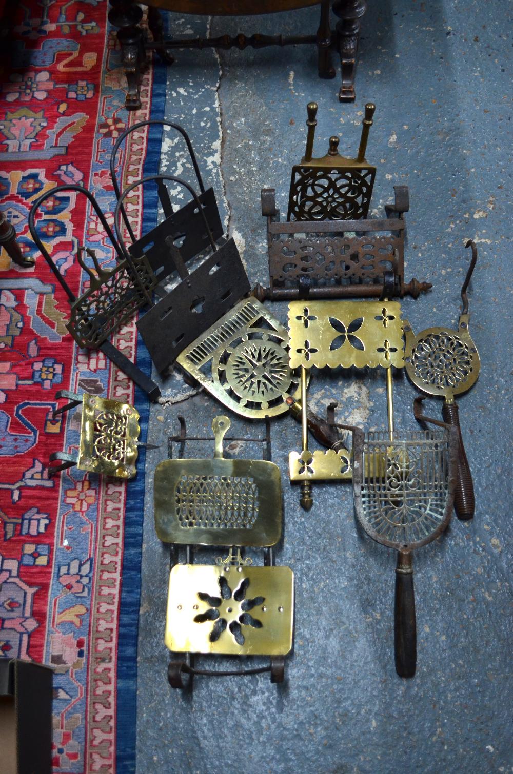 Various 19th century brass and iron grate-mounted hearth trivets (box)