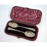 A Victorian cased pair of berry spoons of Georgian origin,