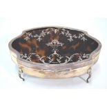 A silver, tortoiseshell and pique-work trinket box with velvet lining, on chased cabriole supports,