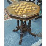 A Victorian walnut and parquetry octagonal chess table on four turned pillars and swept supports