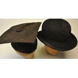 A black bowler hat, retailed by Joshua Daw 10 & 11 High St. Exeter, 56.5 cm circ. x 20.