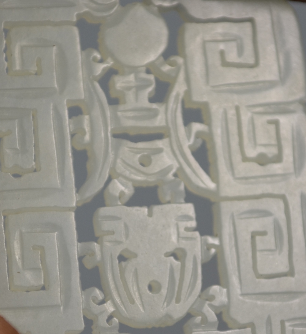 A Chinese green jade pendant of whitish hue, - Image 7 of 7