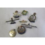 Various silver sweetheart brooches.