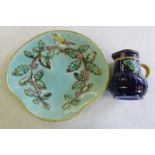 Victorian majolica jug with pewter lid; majolica plate with Christmas decoration.