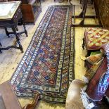 Persian runner with lozenge star design centre, lined borders, 37" wide x 132" long.
