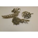 Four silver marcasite brooches.
