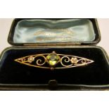 9ct gold peridot and seed pearl bar brooch.