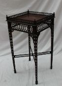 A 19th century mahogany silver table with a square top and pierced gallery on four pierced legs,