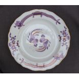 A Meissen porcelain plate painted to the rim with stylised dragons,