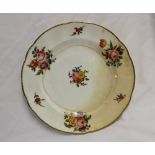 A Nantgarw porcelain plate, painted with sprays of garden flowers, impressed NANT-GARW C.W., 24.