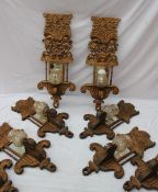 A set of six carved and gilt mirrored wall lights decorated with waves and flowers from the Empress