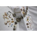 Assorted costume jewellery including a nurses belt, brooches, glasses,