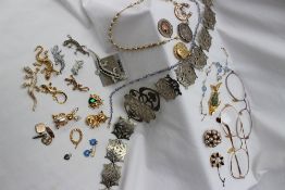 Assorted costume jewellery including a nurses belt, brooches, glasses,