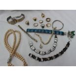 Assorted costume jewellery including paste set rings, faux pearls, brooches,