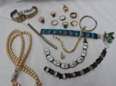 Assorted costume jewellery including paste set rings, faux pearls, brooches,