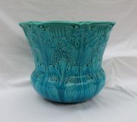 A Burmantofts turquoise glaze faience jardiniere, moulded with leaves and basket weave,