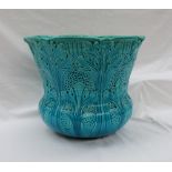 A Burmantofts turquoise glaze faience jardiniere, moulded with leaves and basket weave,