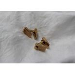 A pair of 9ct yellow gold cufflinks, with textured wedge shaped hinged ends,