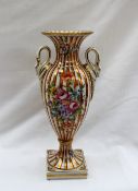 A Derby porcelain baluster vase painted with flowers and leaves with orange and gold stripes,