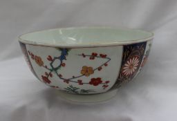 An 18th century Worcester porcelain bowl painted with sprays of garden flowers within separate