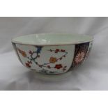 An 18th century Worcester porcelain bowl painted with sprays of garden flowers within separate