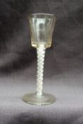 An 18th century wine glass, with tapering bowl,