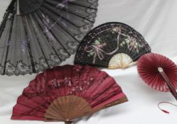 A paper and treen fan painted with figures dancing,