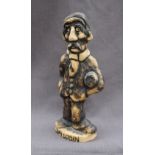 A John Hughes pottery grogg of "Dai Losin", signed to the base,