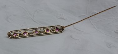 A pearl and pink sapphire bar brooch,