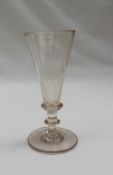 A 19th century ale glass with a faceted tapering trumpet shaped bowl on a ring turned stem and