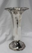 An Edward VII silver vase of flared form with a pierced rim and octagonal tapering body on a