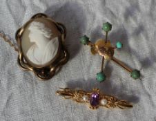 An amethyst and pearl bar brooch to a yellow metal setting together with a yellow metal bar brooch