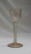An 18th century dram glass, with rounded stop fluted bowl,