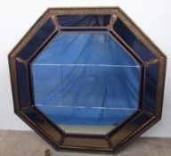 A 20th century gilt metal wall mirror of octagonal form,