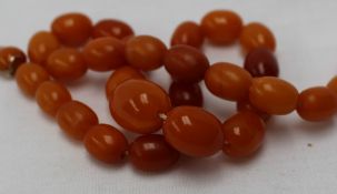 An amber bead necklace,