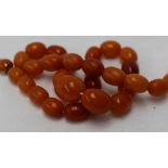 An amber bead necklace,