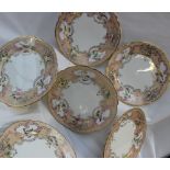 A set of six 19th century English porcelain plates with a gilt rim and orange border with gilt