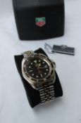 A Gentleman's Tag Heuer 1000 professional wristwatch, on a bi coloured stainless steel strap,