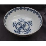 An early 18th century Worcester blue and white bowl decorated in the "fruit and wreath" pattern,