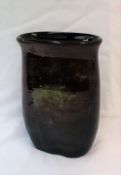 A Moorcroft lustre vase, of flattened oval form, with graduated red and green ground,