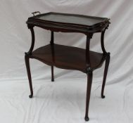 An Edwardian mahogany tray top table, with a serpentine shaped top with removable tray,