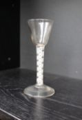 An 18th century wine glass, with a tapering bowl,