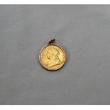 A Victorian gold sovereign dated 1893 in a slip mount